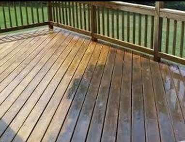 cleaning the deck with the pressure washer
